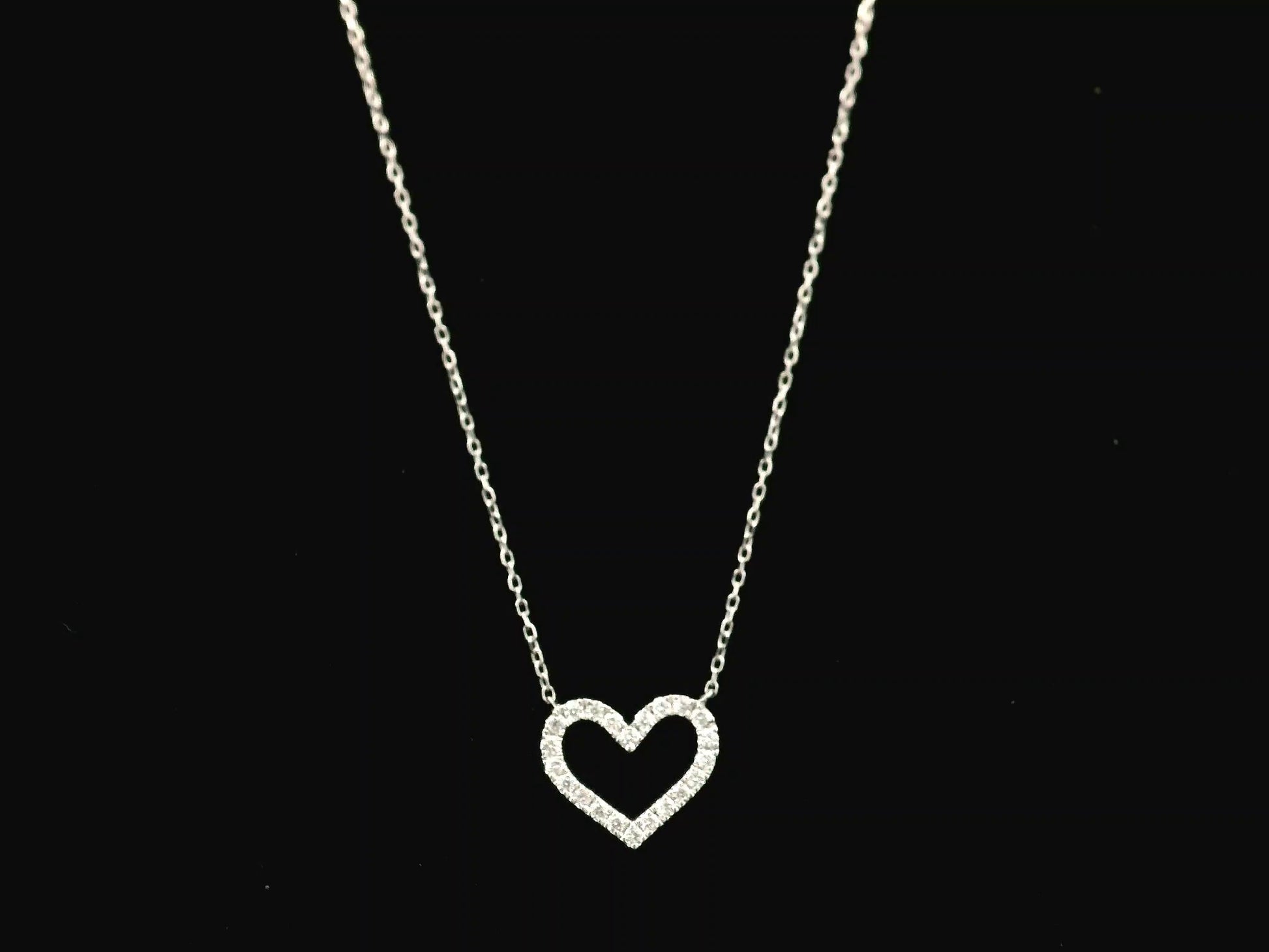 18K white gold open heart diamond necklace featuring 0.20 carat natural diamonds in a delicate pavé setting.