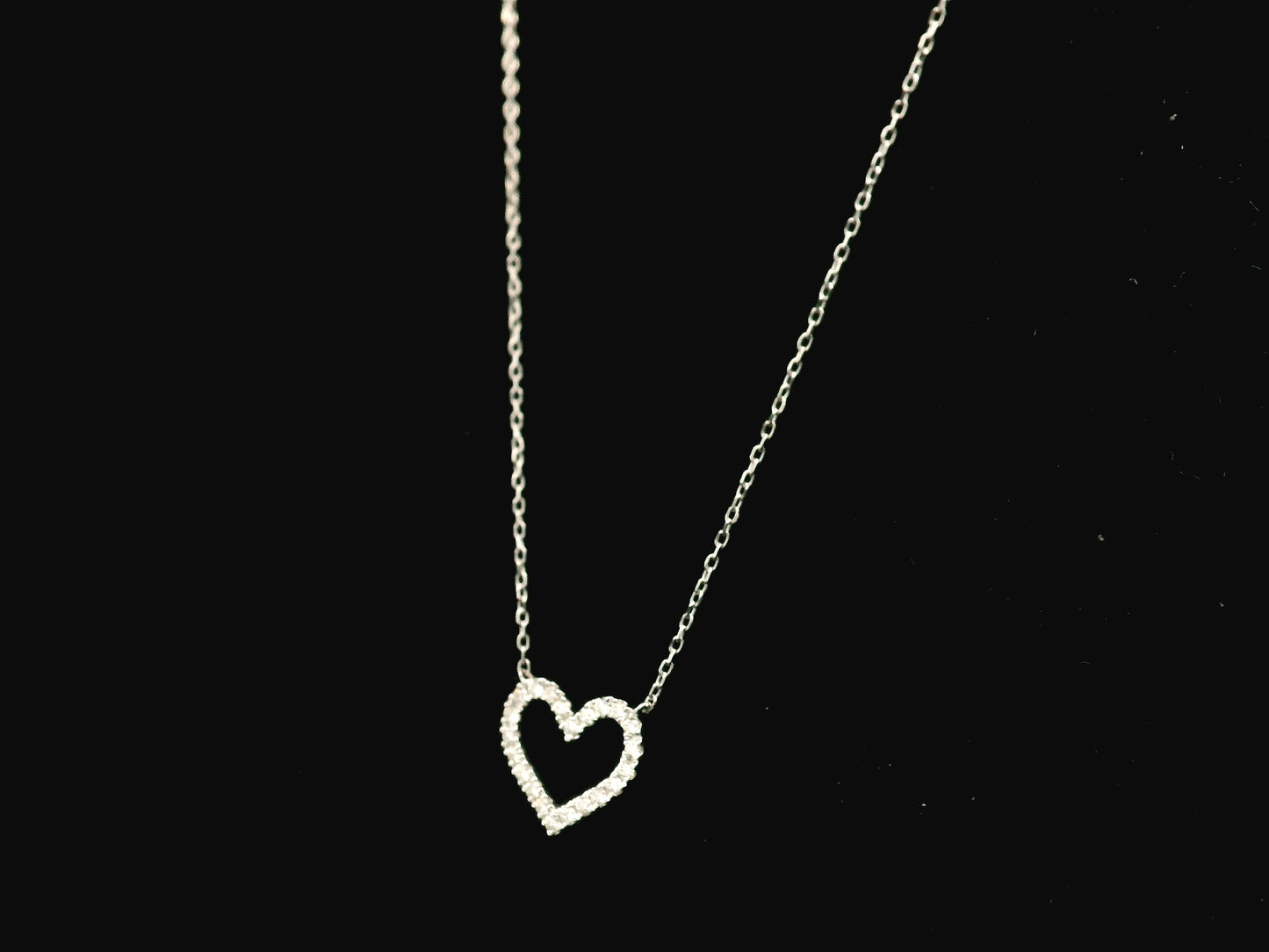 18K white gold open heart diamond necklace featuring 0.20 carat natural diamonds in a delicate pavé setting.