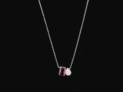18K white gold pendant necklace featuring a 0.63 carat emerald cut pink sapphire paired with a 0.07 carat pear shaped diamond.