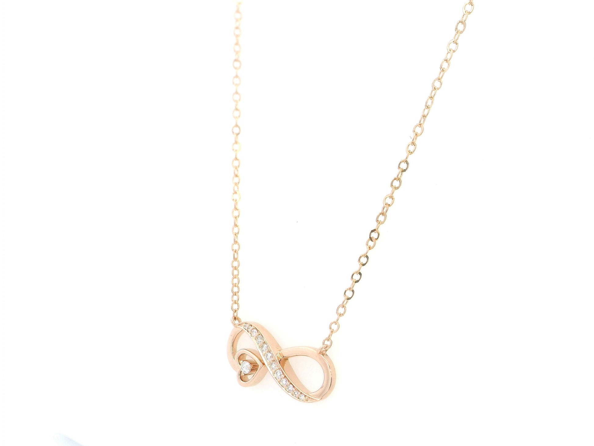 18K rose gold infinity heart diamond necklace featuring 0.13 Carat of natural diamonds in a timeless romantic design.