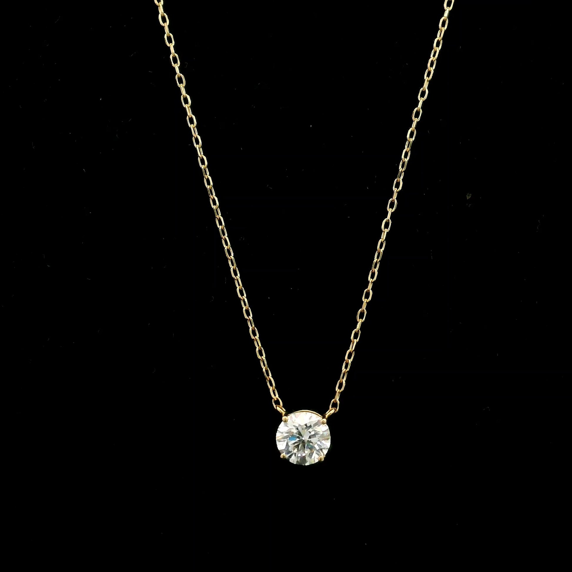 18K yellow gold solitaire necklace featuring a 1.01 carat GIA certified round brilliant natural diamond in a classic four-prong setting.
