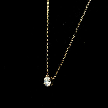 18K yellow gold solitaire necklace featuring a 1.01 carat GIA certified round brilliant natural diamond in a classic four-prong setting.