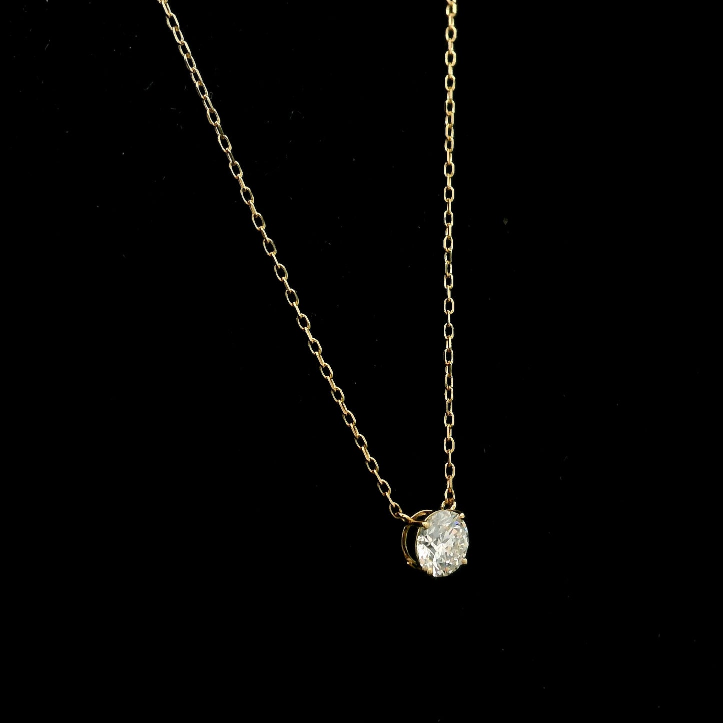 18K yellow gold solitaire necklace featuring a 1.01 carat GIA certified round brilliant natural diamond in a classic four-prong setting.