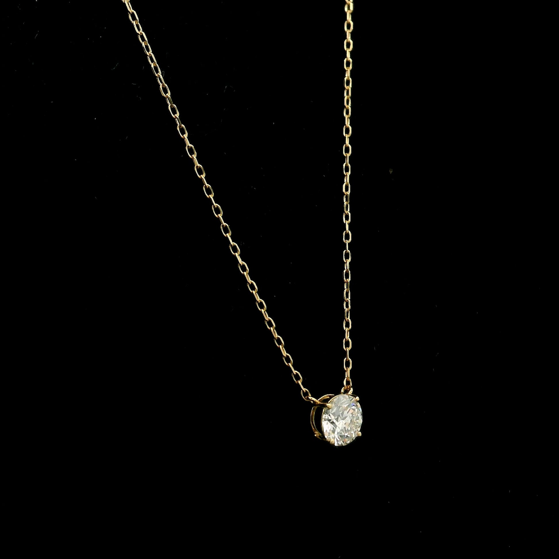 18K yellow gold solitaire necklace featuring a 1.01 carat GIA certified round brilliant natural diamond in a classic four-prong setting.