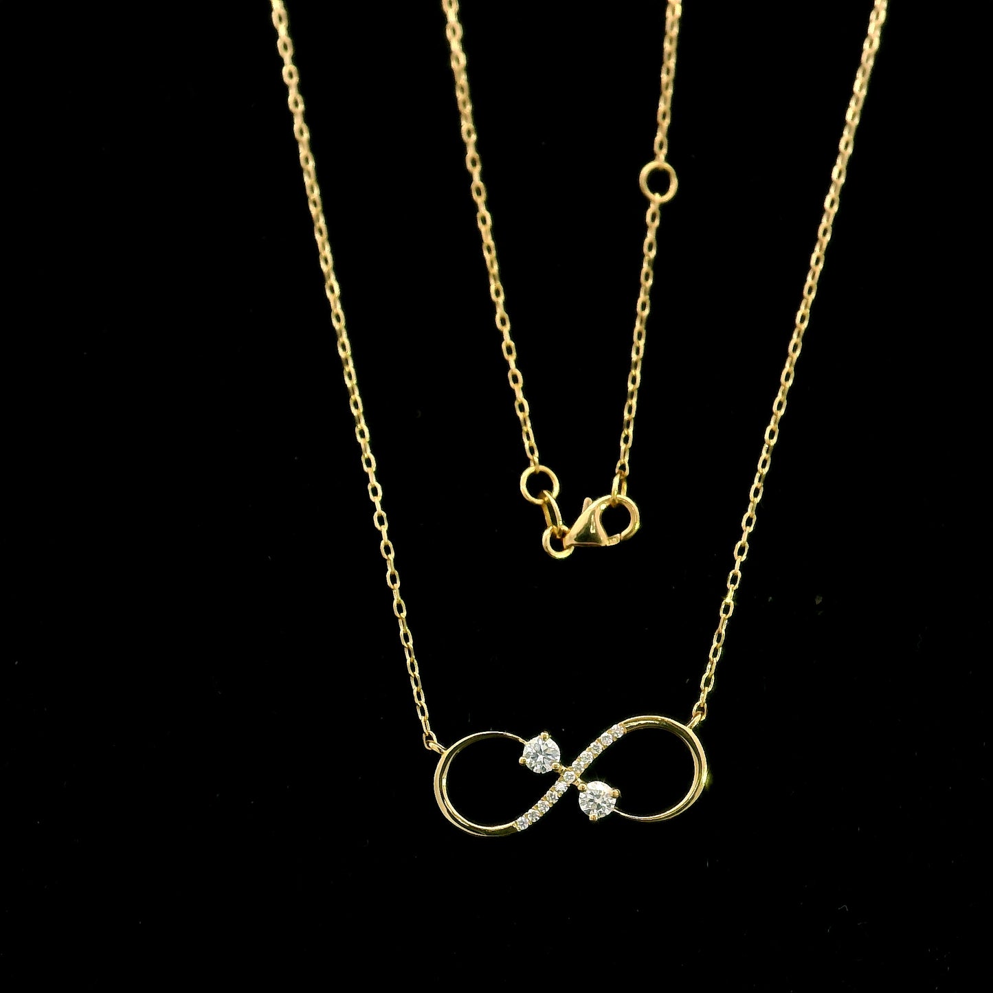 18K yellow gold infinity diamond necklace with round natural diamonds and pavé-set infinity pendant, handcrafted fine jewellery by Emirates Diamonds.