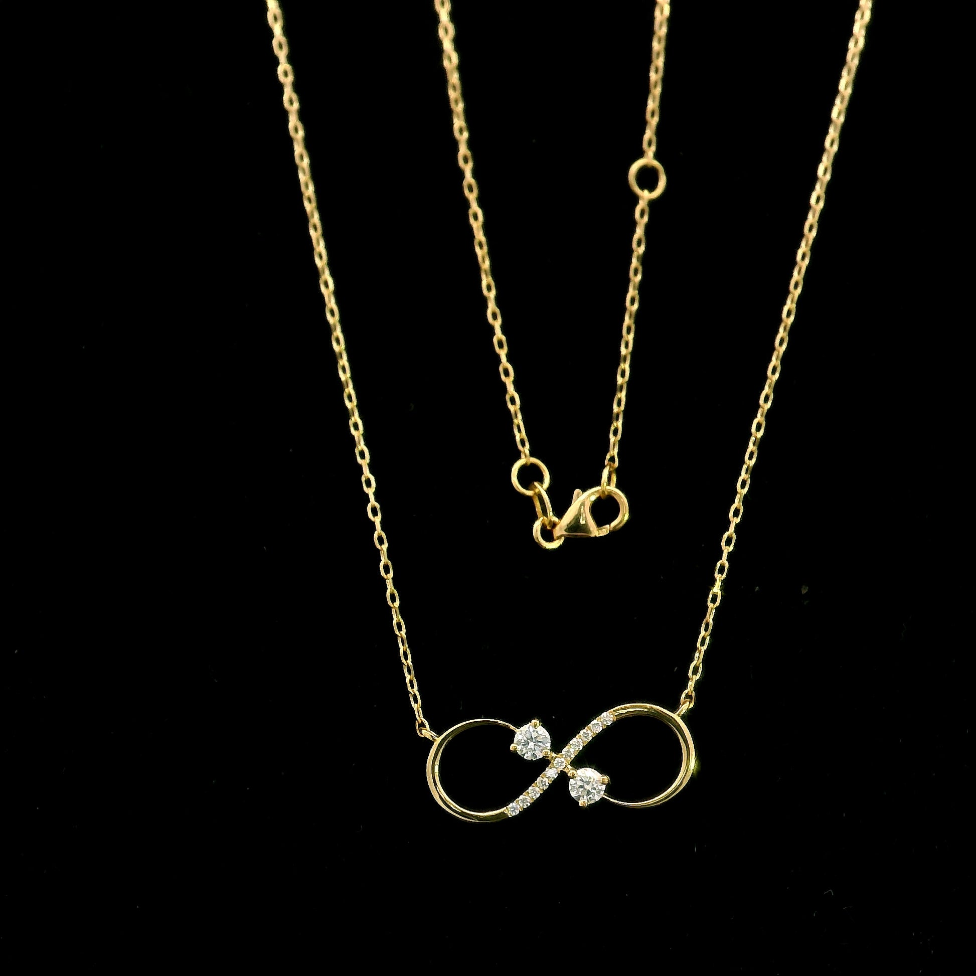 18K yellow gold infinity diamond necklace with round natural diamonds and pavé-set infinity pendant, handcrafted fine jewellery by Emirates Diamonds.