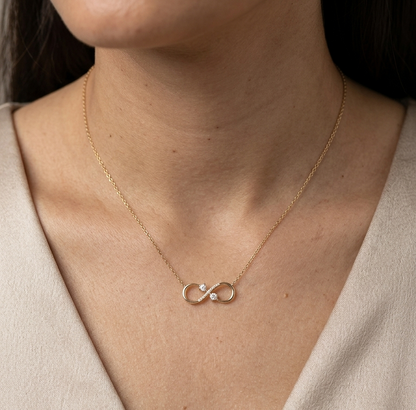 18K yellow gold infinity diamond necklace with round natural diamonds and pavé-set infinity pendant, handcrafted fine jewellery by Emirates Diamonds.