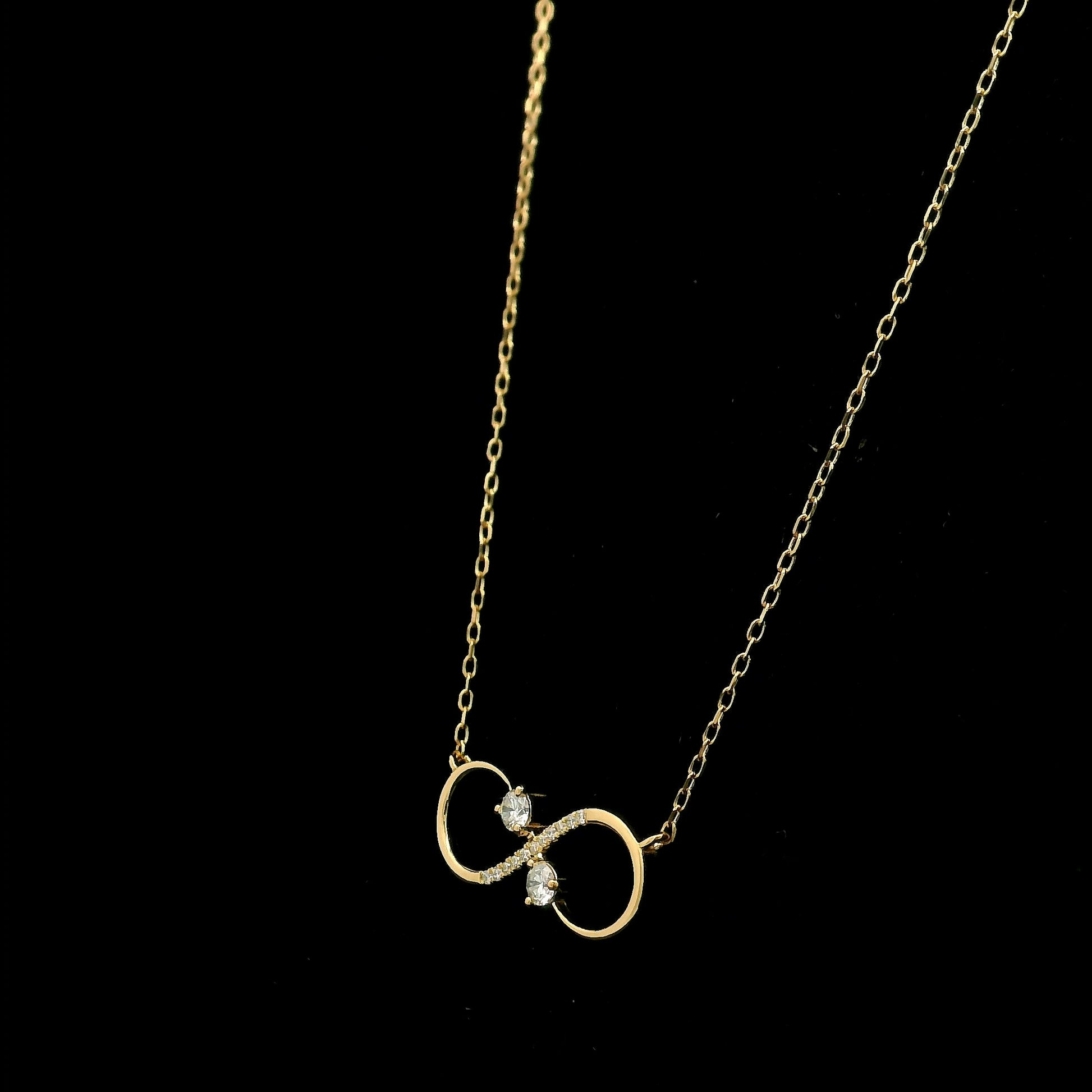 18K yellow gold infinity diamond necklace with round natural diamonds and pavé-set infinity pendant, handcrafted fine jewellery by Emirates Diamonds.
