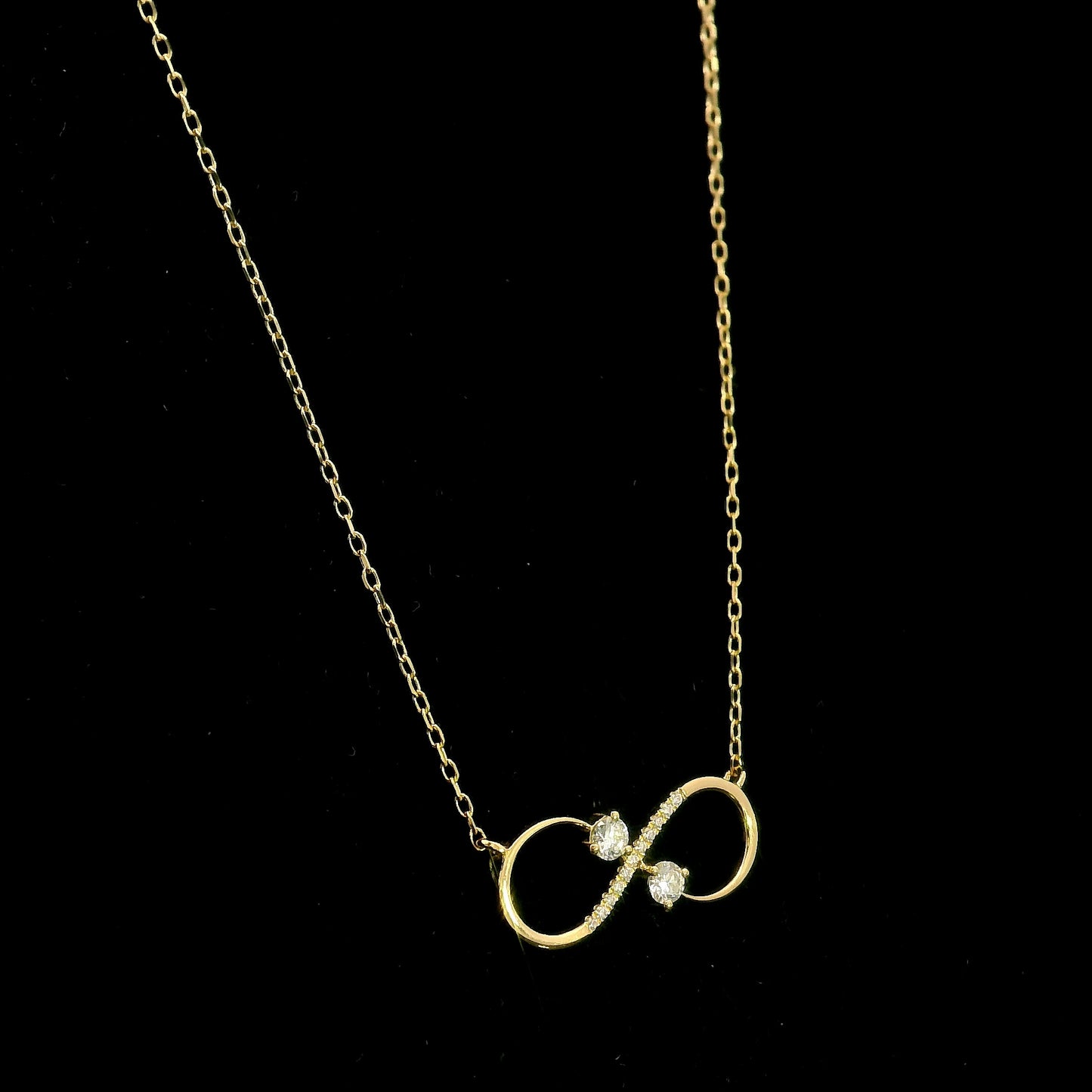 18K yellow gold infinity diamond necklace with round natural diamonds and pavé-set infinity pendant, handcrafted fine jewellery by Emirates Diamonds.