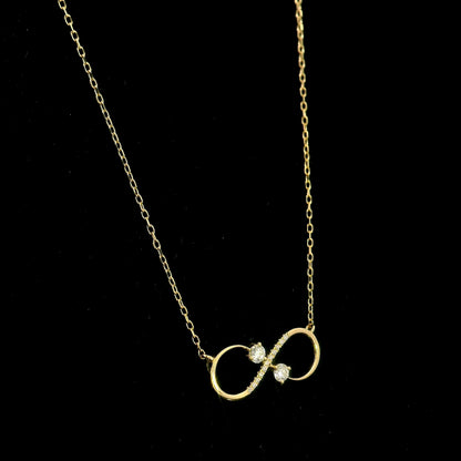 18K yellow gold infinity diamond necklace with round natural diamonds and pavé-set infinity pendant, handcrafted fine jewellery by Emirates Diamonds.