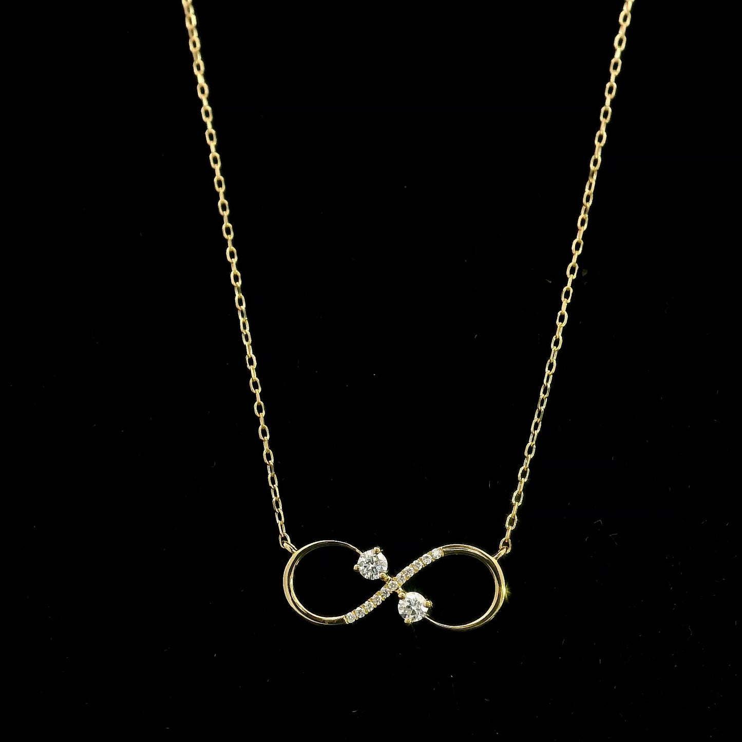 18K yellow gold infinity diamond necklace with round natural diamonds and pavé-set infinity pendant, handcrafted fine jewellery by Emirates Diamonds.