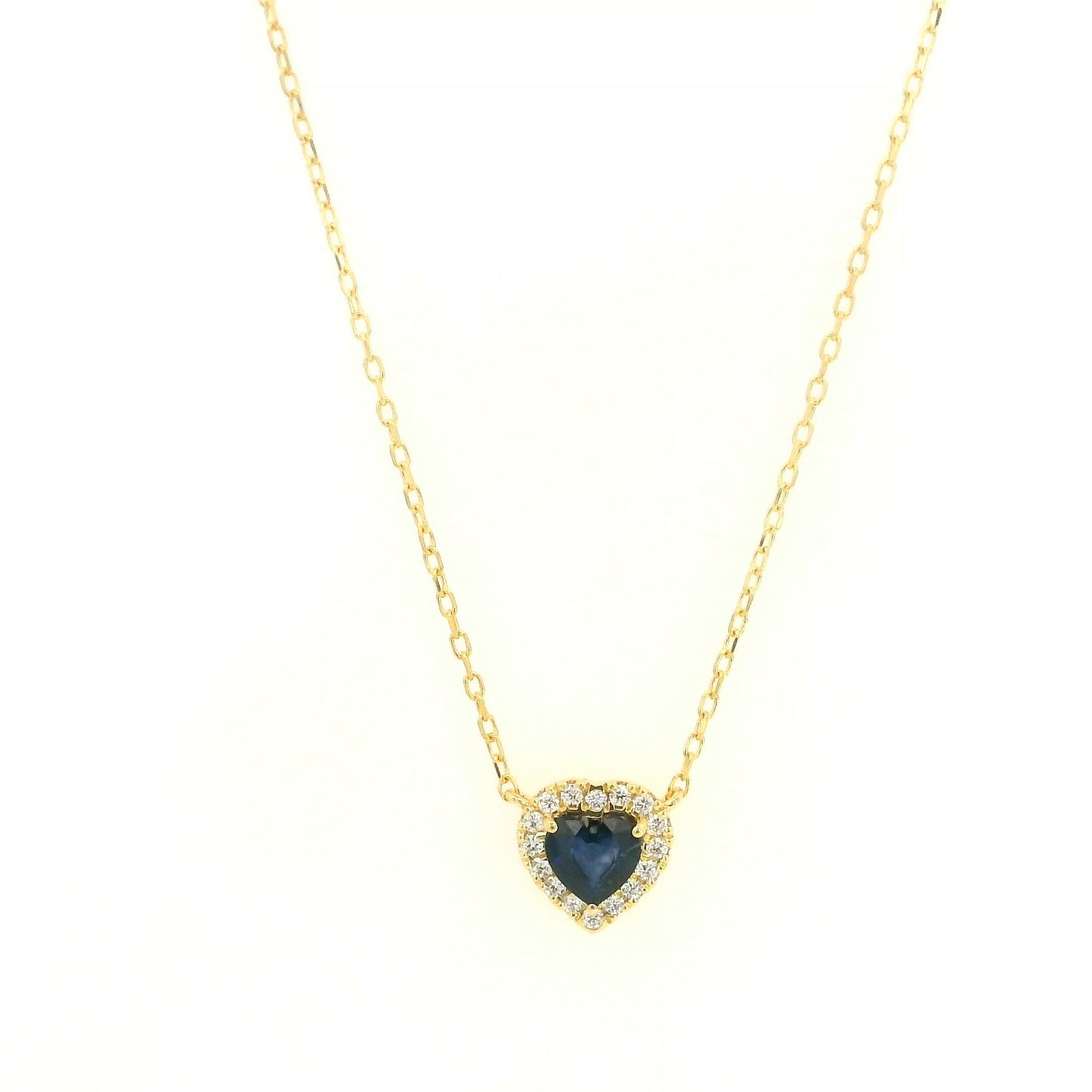 Heart-shaped blue sapphire and diamond halo pendant necklace in 18K yellow gold.