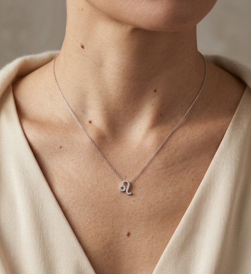 Leo zodiac necklace featuring a natural diamond pavé Leo symbol pendant crafted in 18K white gold with a delicate chain.