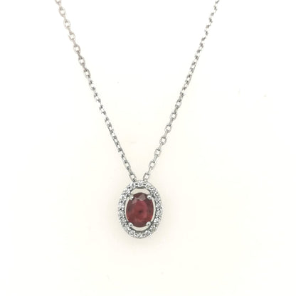 Ruby With A Diamond Halo Pendant In 18k White Gold.