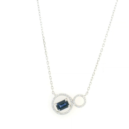 Blue emerald-cut sapphire and diamond necklace in 18K white gold, featuring an asymmetrical double-circle design with round diamond accents.