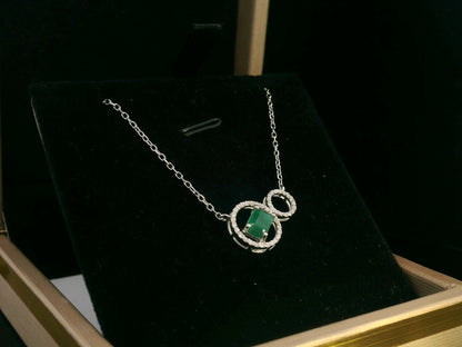 18K White Gold 0.63ct Emerald-Cut Emerald & 0.15ct Diamond Double Circle Necklace – Modern & Elegant