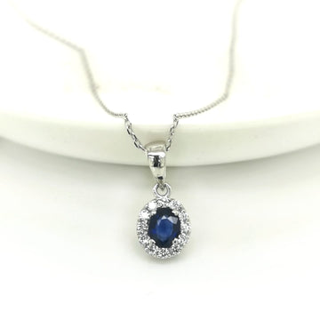 Blue Sapphire With Diamond Halo Pendant In 18k White Gold.