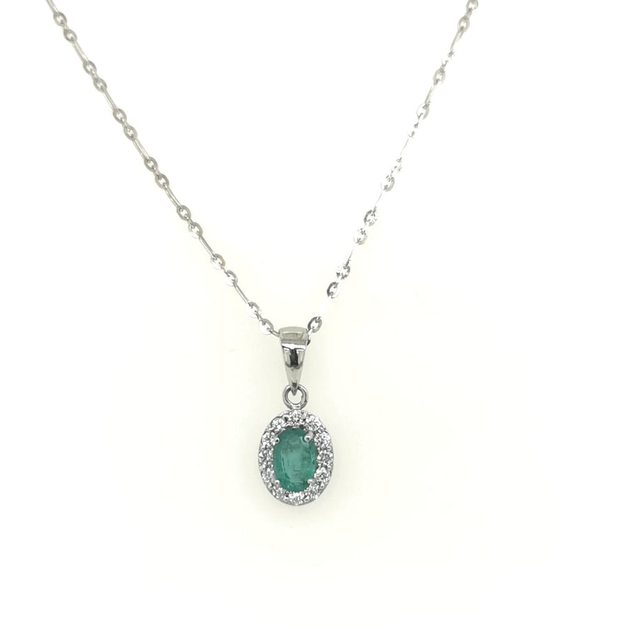 Emerald With Diamond Halo Pendant In 18k White Gold.