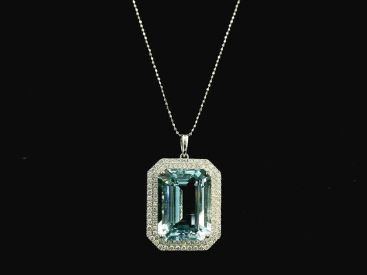 Emerald-cut aquamarine and diamond halo pendant in 18K white gold with large natural aquamarine center stone