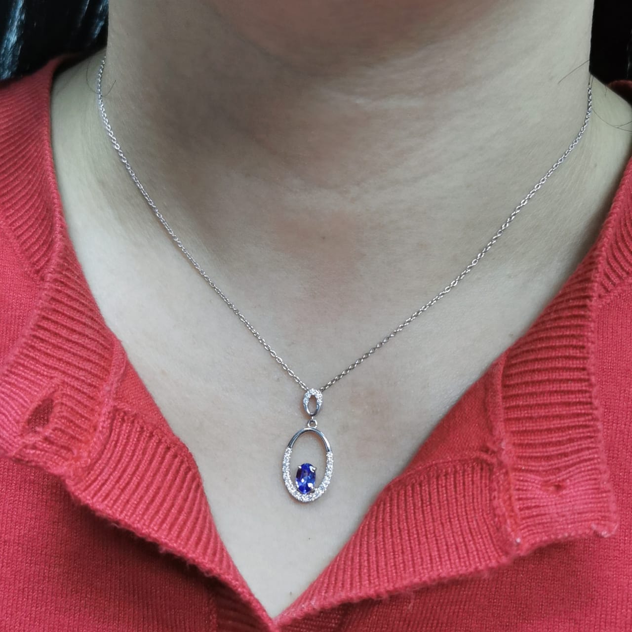 18K white gold tanzanite and diamond oval pendant featuring a 0.47ct violet-blue tanzanite and 0.21ct diamonds, designed for layering