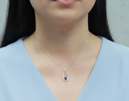 Tanzanite & Diamond Oval Halo Pendant in 18K White Gold