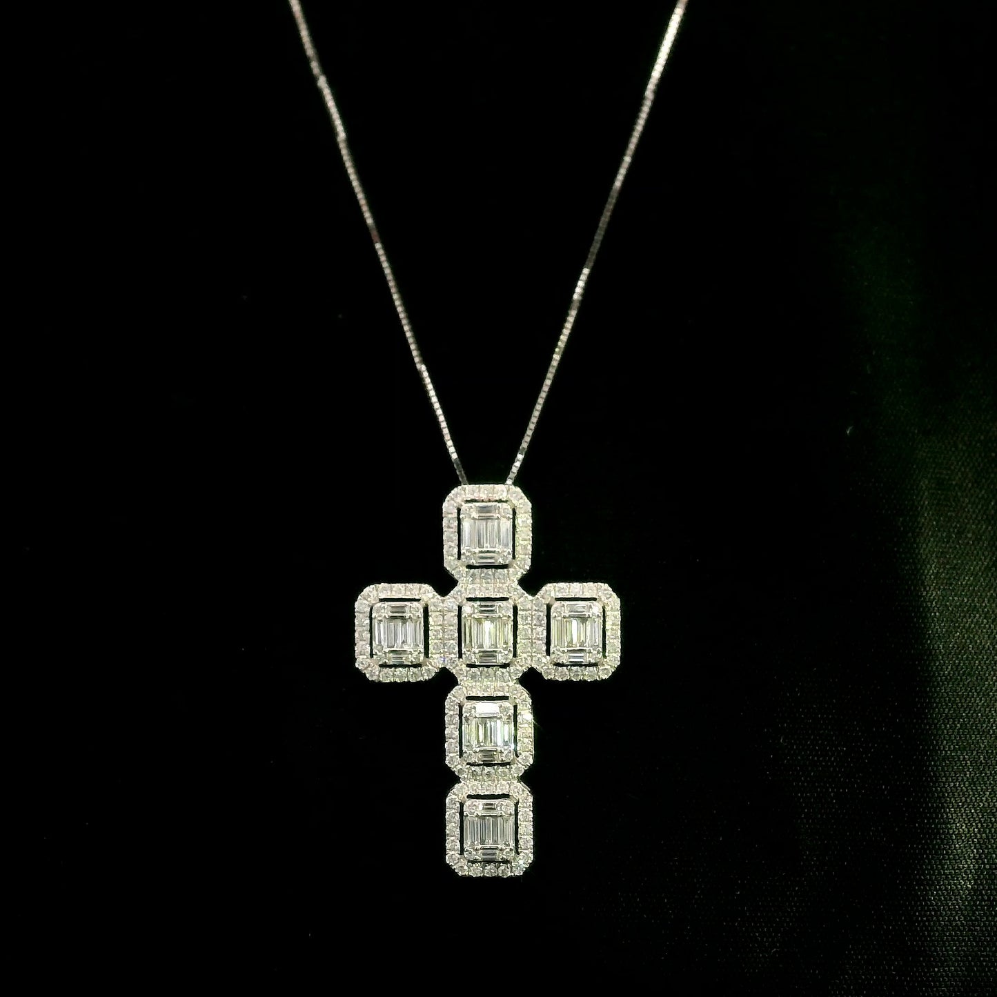 18K white gold cross pendant set with baguette and round brilliant diamonds, 1.41 carat total diamond weight