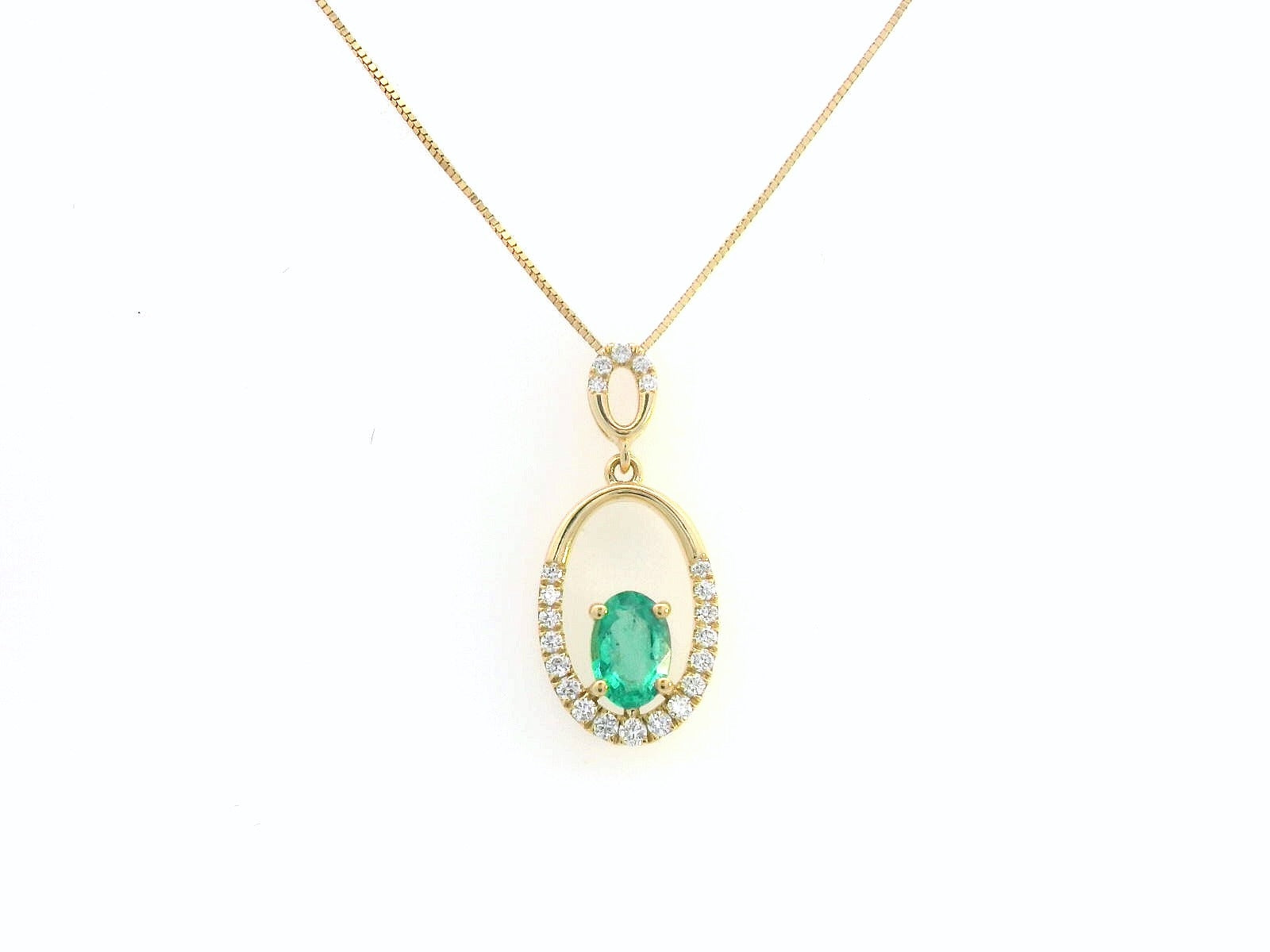 18K gold emerald and diamond oval pendant featuring a 0.42ct green emerald and 0.15ct diamonds, designed for layering—pair with various chain styles for a trendy, personalized look.