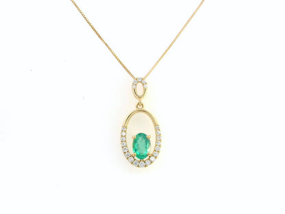 18K gold emerald and diamond oval pendant featuring a 0.42ct green emerald and 0.15ct diamonds, designed for layering—pair with various chain styles for a trendy, personalized look.