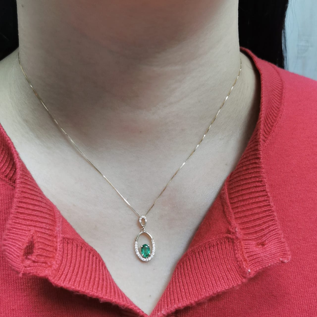 18K gold emerald and diamond oval pendant featuring a 0.42ct green emerald and 0.15ct diamonds, designed for layering—pair with various chain styles for a trendy, personalized look.