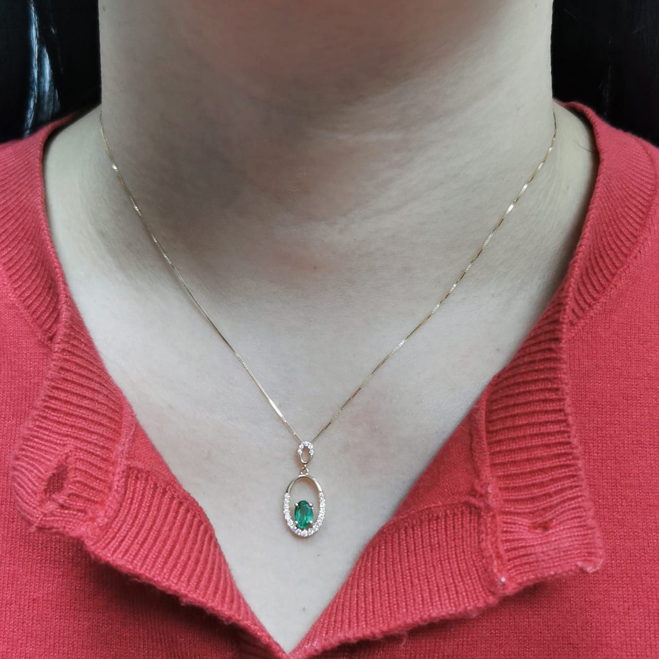 18K gold emerald and diamond oval pendant featuring a 0.42ct green emerald and 0.15ct diamonds, designed for layering—pair with various chain styles for a trendy, personalized look.