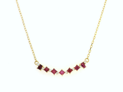 Elegant 18K gold necklace with square-cut rubies (0.67ct) and round diamonds (0.08ct), set on a fine gold chain – perfect July birthstone jewelry.