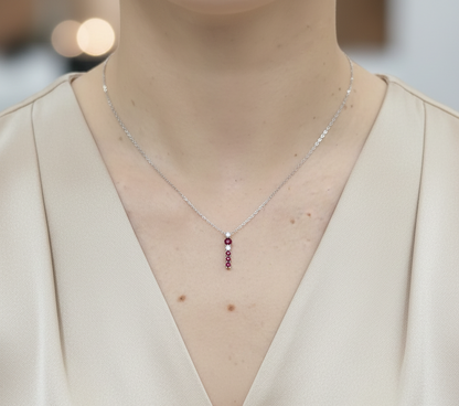 18K white gold ruby and diamond vertical pendant necklace by Emirates Diamonds