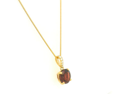 Round garnet and diamond pendant 2.03ct set in 18K yellow gold by Emirates Diamonds