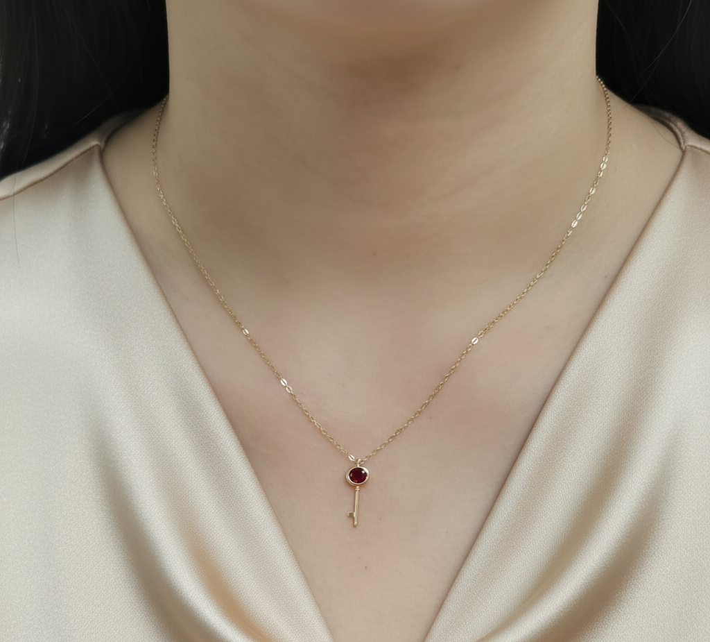 18K yellow gold ruby key necklace with 0.37 carat natural ruby by Emirates Diamonds