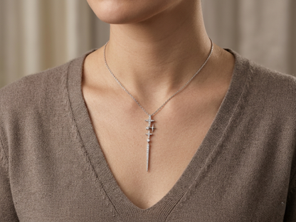 18K white gold diamond starburst drop necklace with celestial-inspired pendant design.