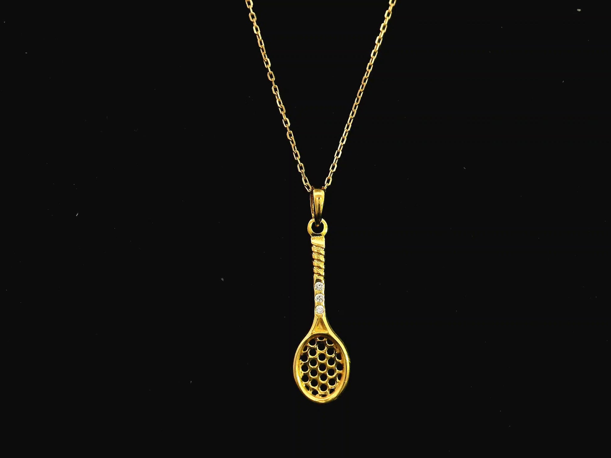 18K yellow gold tennis racket pendant necklace with diamond accents by Emirates Diamonds