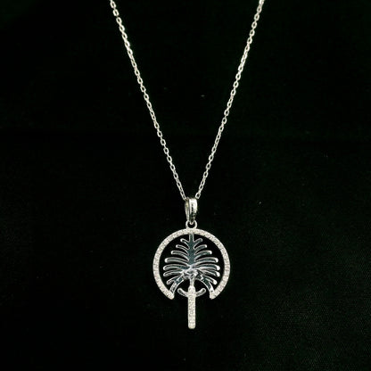 18K white gold Palm Jumeirah diamond pendant inspired by Dubai’s iconic palm-shaped island.