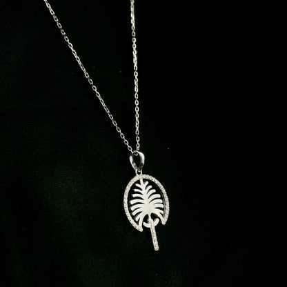 18K white gold Palm Jumeirah diamond pendant inspired by Dubai’s iconic palm-shaped island.