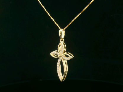 Elegant 18K gold cross pendant with pavé-set diamonds, featuring marquise-shaped curves and 0.10 carat diamond accents.