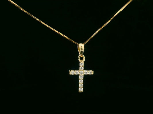 Petite diamond cross pendant in 18K gold with 11 round-cut diamonds totaling 0.13 carat