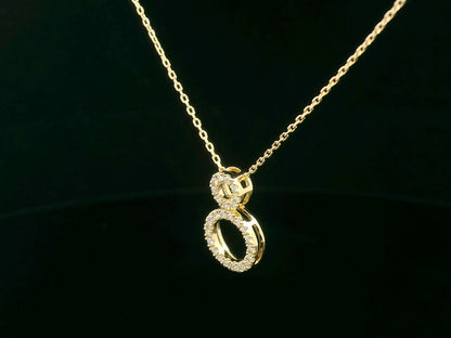18K gold pendant necklace with double open circle design set with 0.18 carat pavé diamonds