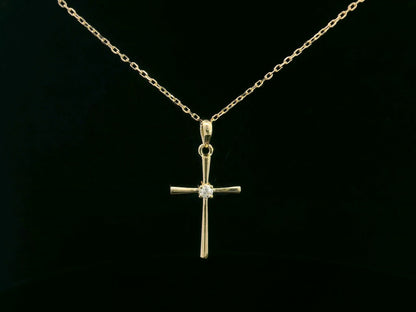 18K yellow gold cross pendant with 0.05 carat center diamond, minimalist design, chain not included