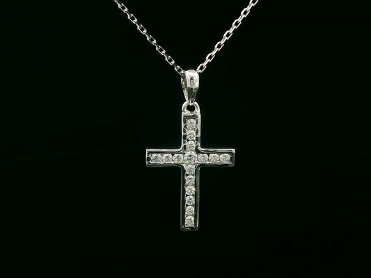 18K gold cross pendant with 0.20 carat round diamonds, religious charm on black background