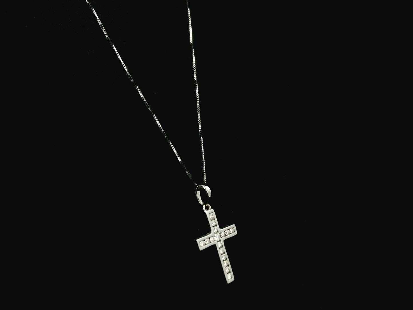 18K white gold diamond cross pendant featuring 0.20 carat natural diamonds in a timeless cross design.