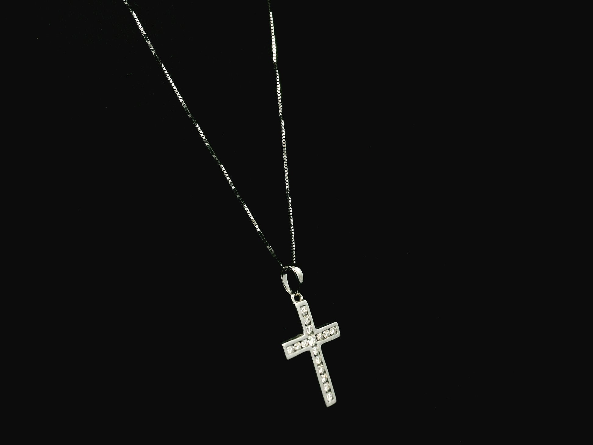 18K white gold diamond cross pendant featuring 0.20 carat natural diamonds in a timeless cross design.