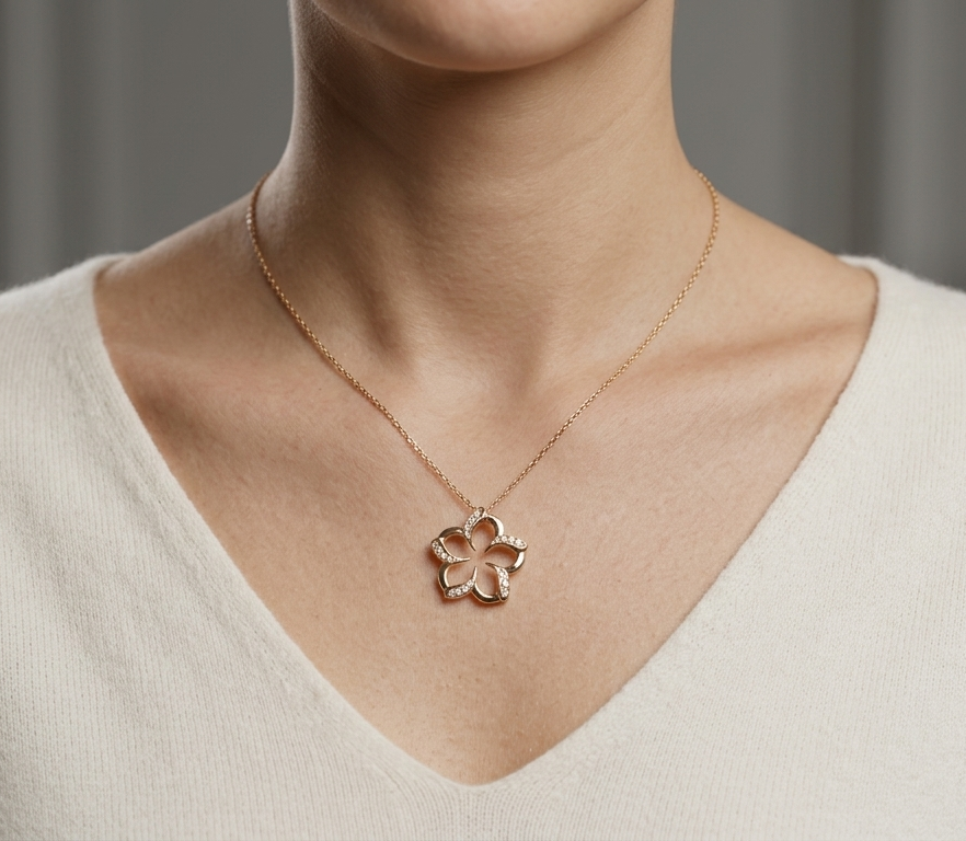 18K rose gold diamond flower pendant featuring an open floral design with 0.23 carat natural round brilliant diamonds.