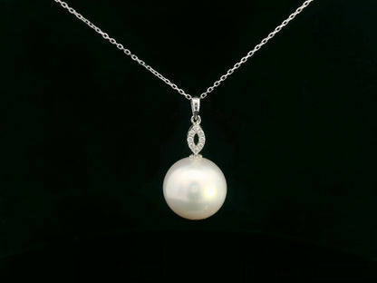 Pearl pendant with diamond-studded marquise connector in white gold