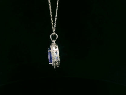 Tanzanite and diamond halo pendant in white gold