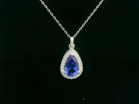Pear-shaped Tanzanite pendant in 18K white gold with diamond halo and diamond-studded bail – 2.81ct total

