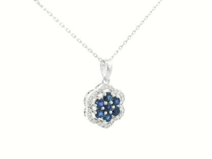 Elegant gemstone pendant featuring blue sapphires and diamonds